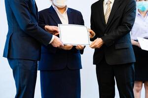 Photograph of the atmosphere during the ceremony of awarding an institution's certificate to trainees who have passed the test. photo