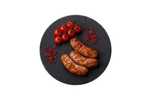 Grilled pork or chicken sausages with salt, spices and herbs photo