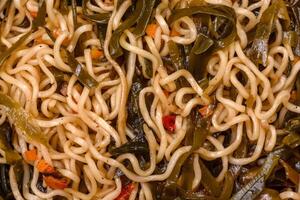 Asian dish rice noodles with salt and spices photo