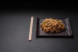 Asian dish rice noodles with salt and spices photo