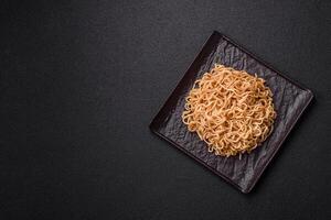 Asian dish rice noodles with salt and spices photo