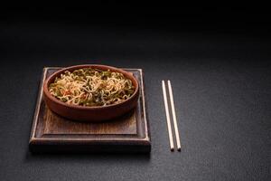 Asian dish rice noodles with salt and spices photo
