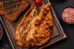 Delicious fresh grilled chicken fillet with spices and herbs photo