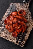Fried sausages sliced with salt and spices as an ingredient for an English breakfast photo
