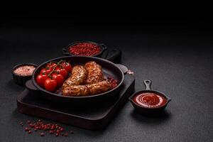 Grilled pork or chicken sausages with salt, spices and herbs photo