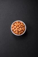Delicious nutritious canned beans in tomato, with salt and spices photo