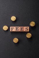 Inscription Fees with wooden cubes, conceptual background with copy space photo