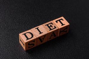Inscription Diet wooden cubes, conceptual background with copy space photo
