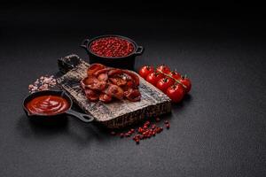 Fried sausages sliced with salt and spices as an ingredient for an English breakfast photo