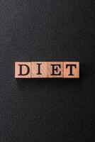 Inscription Diet wooden cubes, conceptual background with copy space photo