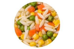 Delicious boiled rice with vegetables or risotto with carrots, peas and corn photo