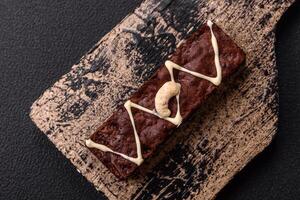 Delicious sweet brownies with chocolate and nuts photo