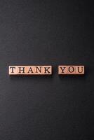 Inscription Thank you with wooden cubes, conceptual background with copy space photo