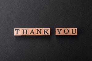 Inscription Thank you with wooden cubes, conceptual background with copy space photo