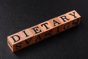Inscription Diet wooden cubes, conceptual background with copy space photo