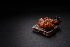 Grilled pork or chicken sausages with salt, spices and herbs photo