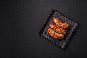 Grilled pork or chicken sausages with salt, spices and herbs photo