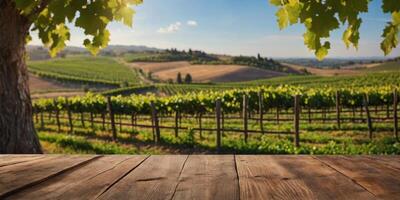 Empty wood table top with on blurred vineyard landscape background, for display or montage your products. photo