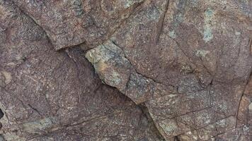 Rough, grey, dark harsh and high contrast granite stone texture background. A close-up of the surface of abstract natural rock. Natural Marble stone wallpaper. photo