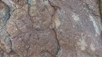 Rough, grey, dark harsh and high contrast granite stone texture background. A close-up of the surface of abstract natural rock. Natural Marble stone wallpaper. photo