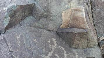 Rough, grey, dark harsh and high contrast granite stone texture background. A close-up of the surface of abstract natural rock. Natural Marble stone wallpaper. photo