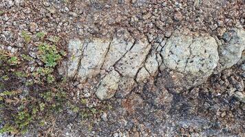 Rough, grey, dark harsh and high contrast granite stone texture background. A close-up of the surface of abstract natural rock. Natural Marble stone wallpaper. photo