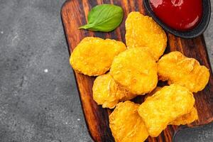 nuggets chicken meat deep fried fresh meal food snack on the table copy space food background rustic top view photo