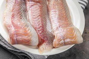 fillet raw white fish cod or halibut fresh meal food snack on the table copy space food background rustic top view photo