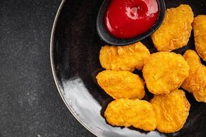 nuggets chicken meat deep fried fresh meal food snack on the table copy space food background rustic top view photo