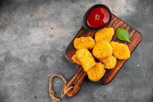nuggets chicken meat deep fried fresh meal food snack on the table copy space food background rustic top view photo