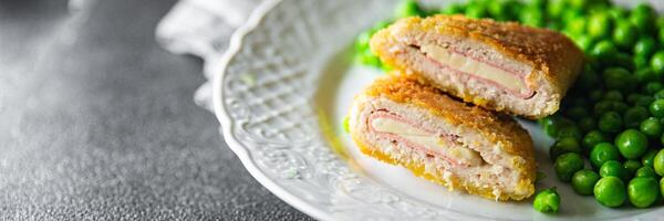 cutlet cordon bleu chicken meat, cheese, bacon meal snack on the table copy space food background rustic top view photo