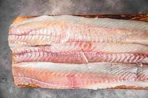 fillet raw white fish cod or halibut fresh meal food snack on the table copy space food background rustic top view photo
