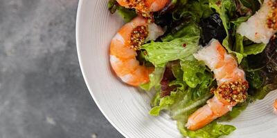 shrimp salad prawns or langoustines green leaf lettuce mix fresh meal food snack on the table copy space food background rustic top view photo