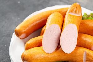 smoked sausages meat pork or chicken, turkey fresh meal food snack on the table copy space food background rustic top view photo