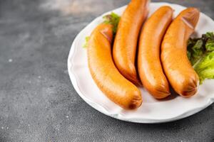 smoked sausages meat pork or chicken, turkey fresh meal food snack on the table copy space food background rustic top view photo