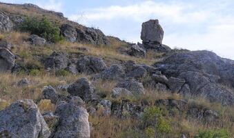 Shell stones and rocks on the territory of Kazantip, steppe landscape with specific flora and fauna, eastern Crimea photo