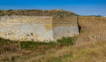 The ruins of the ancient Arabat fortress in the eastern Crimea on the shore of the Sea of Azov photo