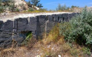 An old abandoned stone quarry where shell rock was mined for construction, eastern Crimea photo