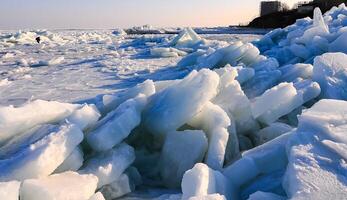 Ice Climatic collapse, heaps of ice blocks on the piers and the shore. The Black Sea near Odessa is frozen photo