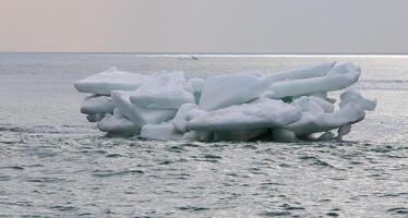The Black Sea near Odessa froze, blocks of ice and ice floes after the ice field melted photo