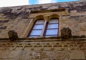 GOZO, MALTA - SEPTEMBER 14, 2012 decorative elements and windows in the citadel of the fortress on the island of Gozo, Malta photo