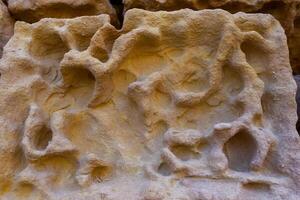 Weathering, erosion and destruction of limestone bricks of ancient structures on the island of Gozo, Malta photo