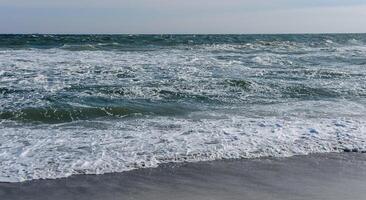 Stormy sea, waves and white foam on the surface, Black Sea photo