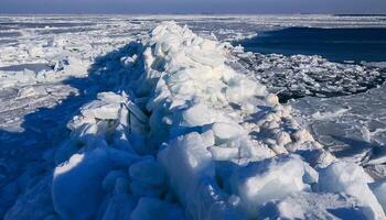 Ice Climatic collapse, heaps of ice blocks on the piers and the shore. The Black Sea near Odessa is frozen photo