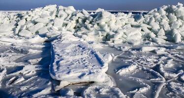 Ice Climatic collapse, heaps of ice blocks on the piers and the shore. The Black Sea near Odessa is frozen photo