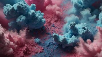 Two brushes with pink and blue make up powder impact to make a colorful cloud. photo