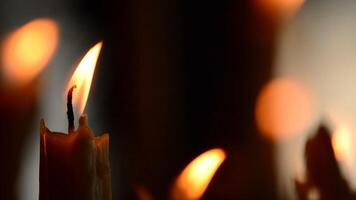 Candle with candles defocused in background video