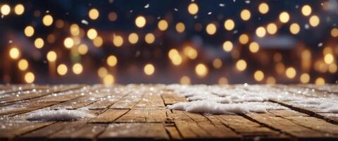 Winter festive New Year background - surface of wooden planks with snow cap on light blurred background with Christmas lights. photo