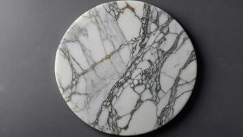White empty marble texture round board on grey background Top view Copy space. photo