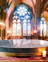 Marble Tabletop with Candle and Church Window in Background photo